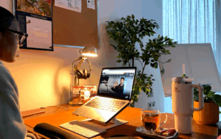 Collette Gee working at her desk watching Amazon Prime’s The Girlfriend while writing a blog review.