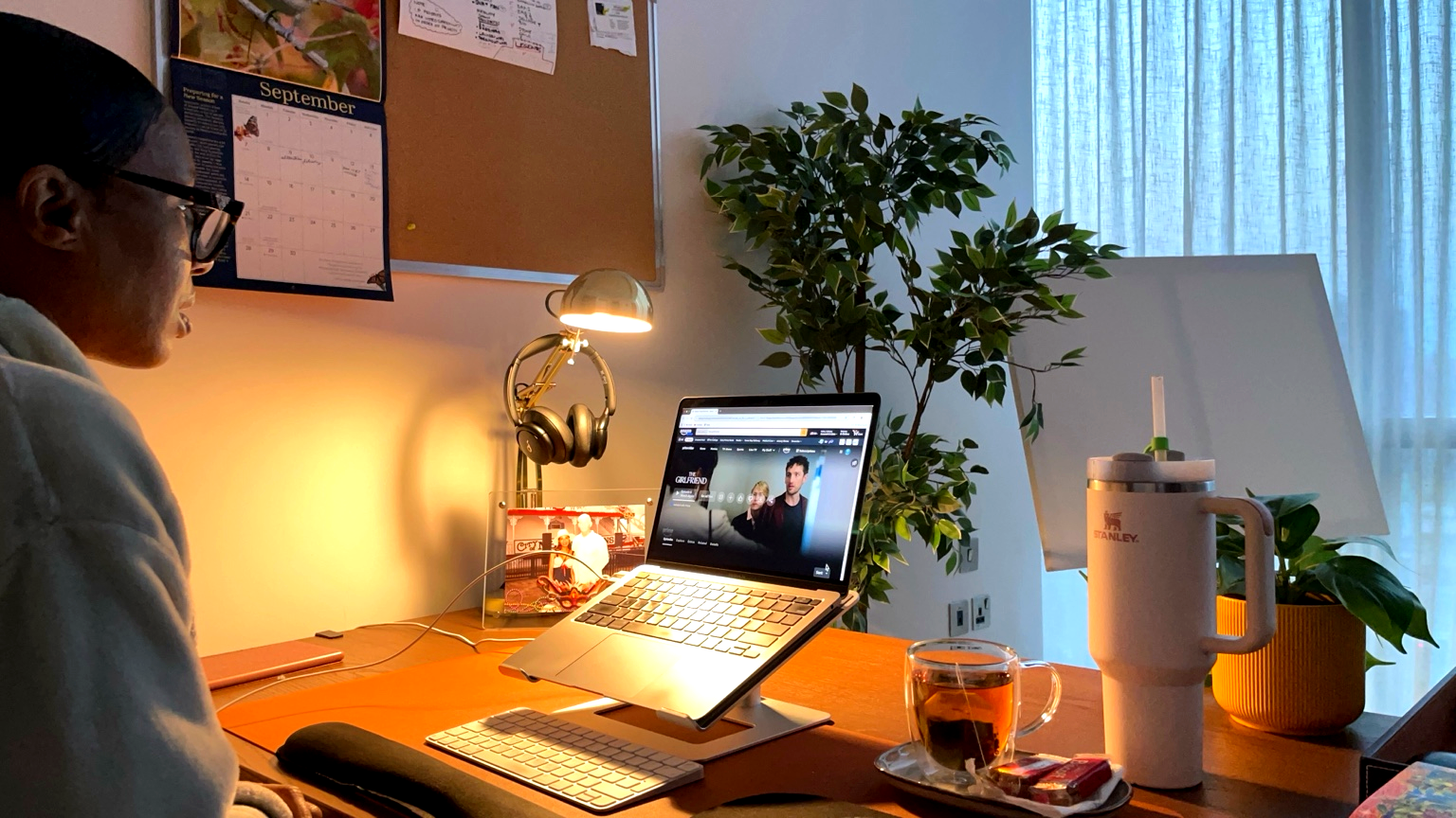 Collette Gee working at her desk watching Amazon Prime’s The Girlfriend while writing a blog review.